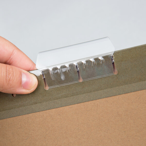 A hand holding a PFX SureHook letter size file folder.