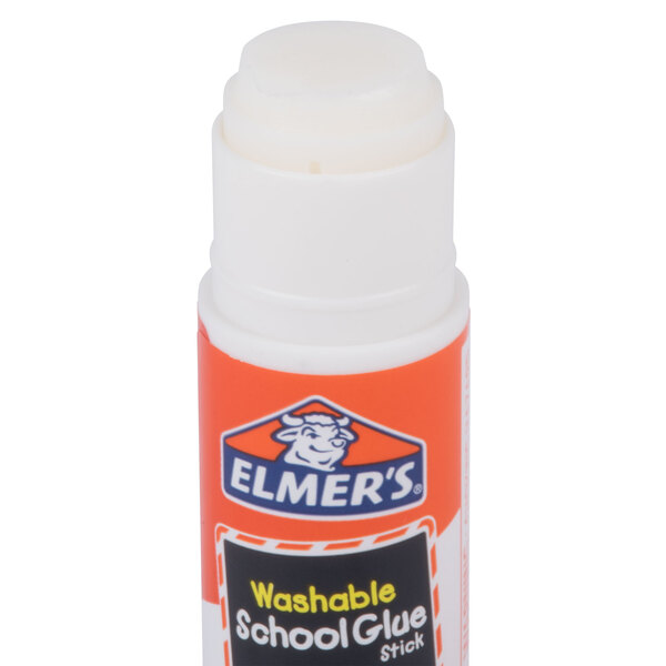 An Elmer's clear glue stick with an orange and white logo.