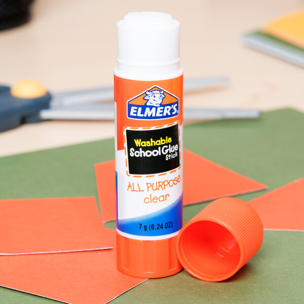 An Elmer's clear glue stick on a table.