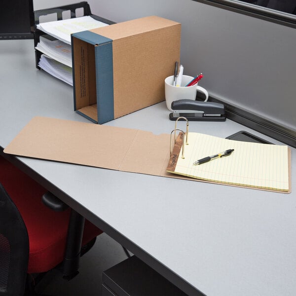 A Globe-Weis Columbia Kraft binder case on a shelf with papers.