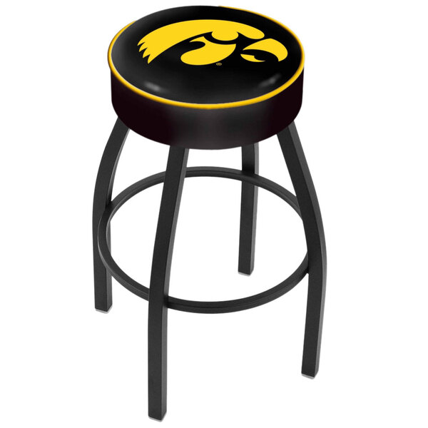 A black swivel bar stool with a yellow University of Iowa logo on the padded seat.