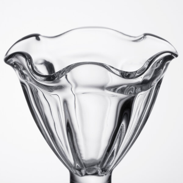A clear Libbey tulip sundae glass with a wavy edge.