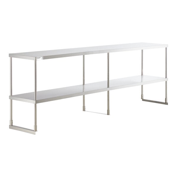 A long, two-tiered stainless steel shelf with four supporting legs and an open design.