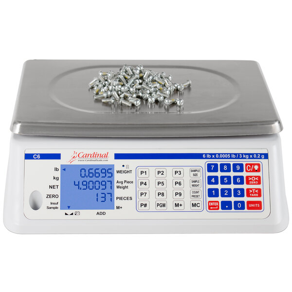 A Cardinal Detecto digital counting scale with screws on it.