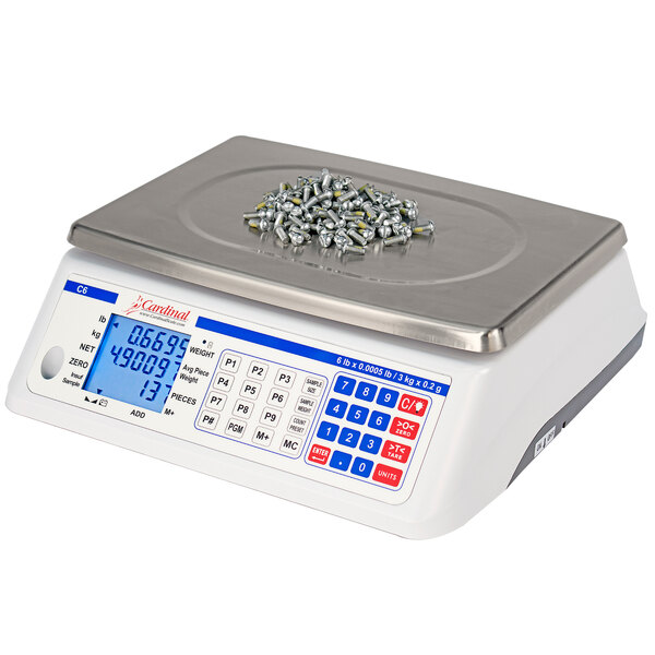 A Cardinal Detecto digital counting scale with a pile of screws on it.