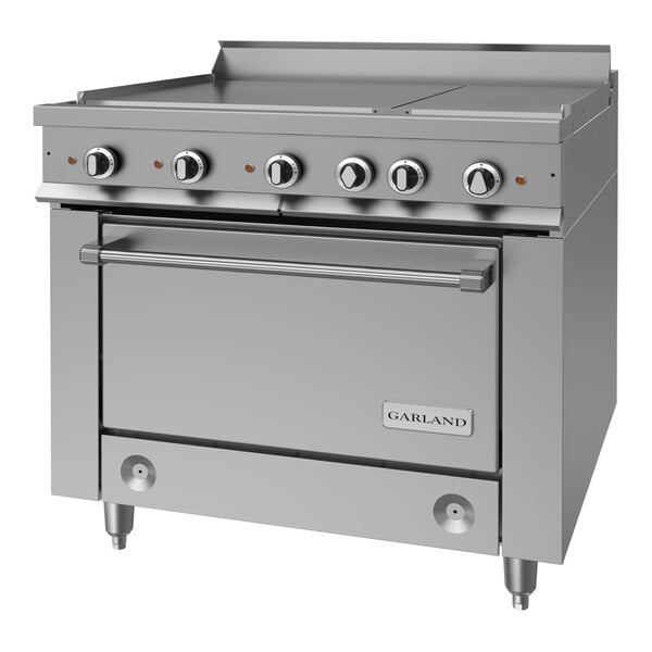A heavy-duty stainless steel electric range with multiple control knobs, a flat cooking surface, and a standard oven below.