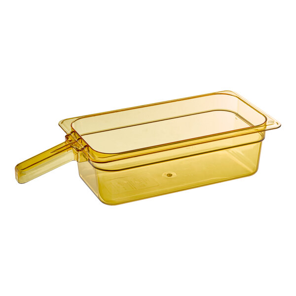 A yellow Carlisle StorPlus 1/3 size plastic food pan with a handle.