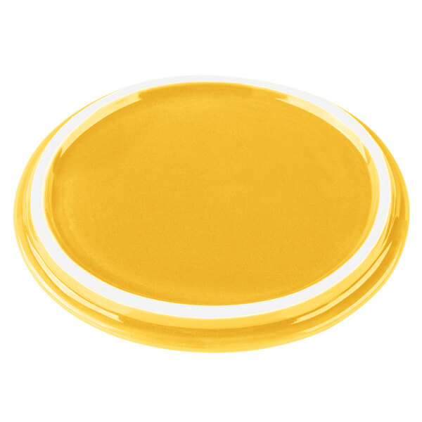 A yellow porcelain lid with a white border.