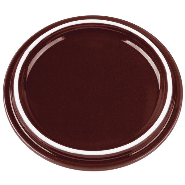 A burnt umber porcelain lid with a white rim.
