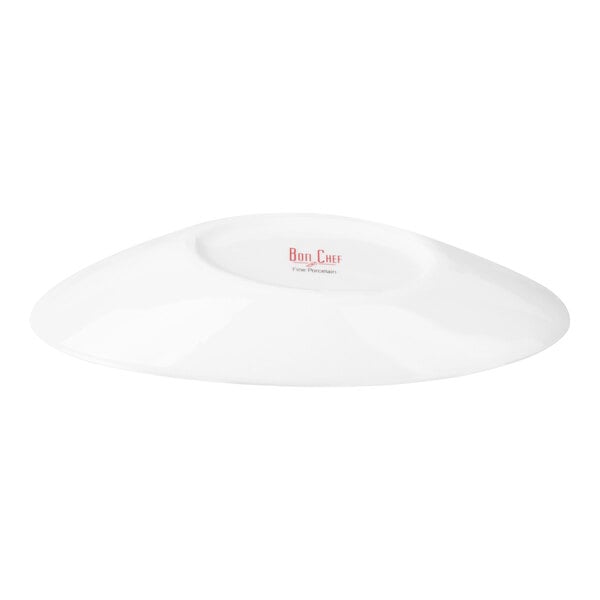 A white, oval-shaped porcelain bowl shown from a low angle, highlighting its slanted design and smooth surface.