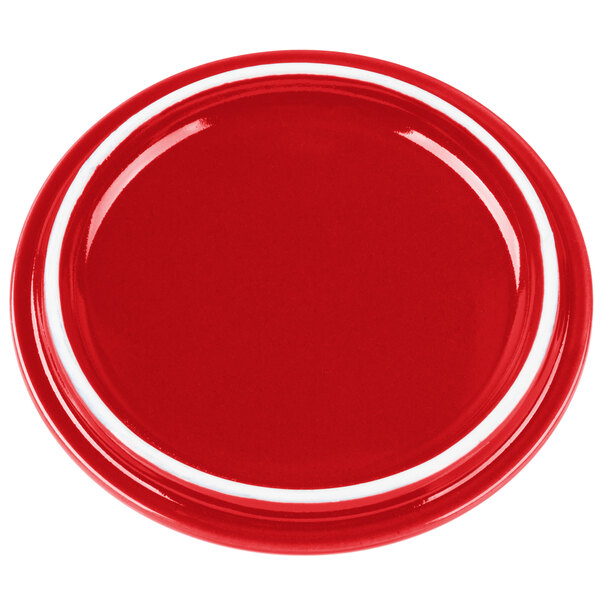 A red porcelain lid with a white rim.