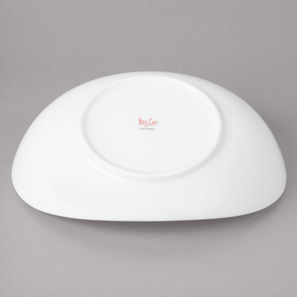 A white porcelain pasta bowl with a red logo on it.