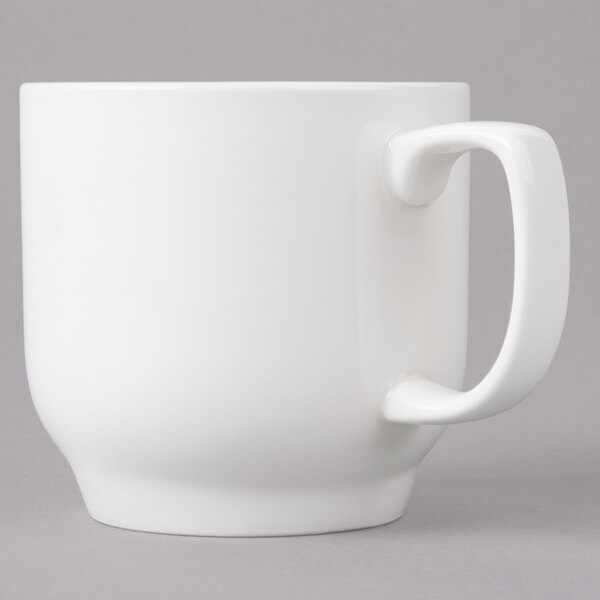 A Bon Chef white porcelain cup with a handle.