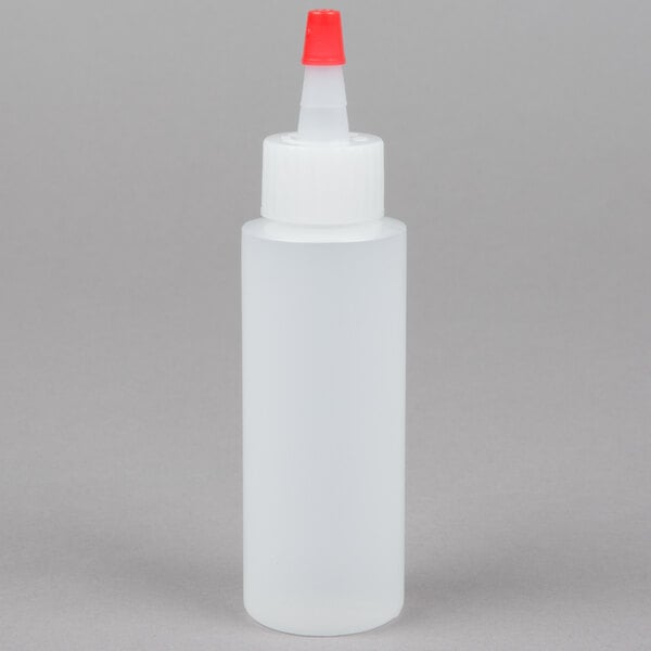 A white plastic Tablecraft squeeze bottle with a red cap.
