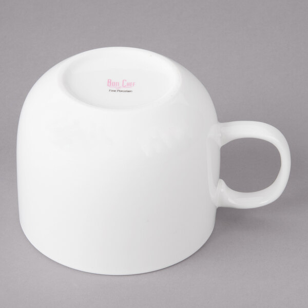 A white porcelain cappuccino cup with a handle.