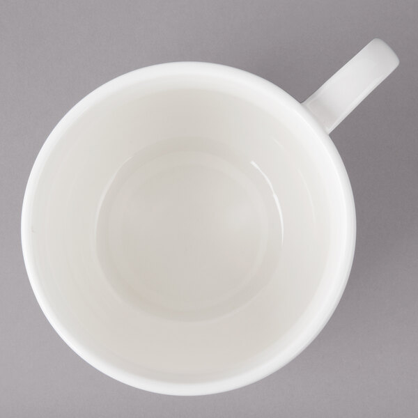 A white Bon Chef porcelain cappuccino cup with a handle.