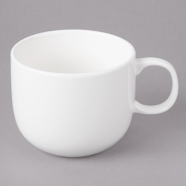 A white Bon Chef porcelain cappuccino cup with a handle.