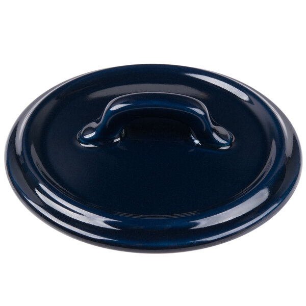 A Bon Chef cobalt blue porcelain cocotte lid with a handle.