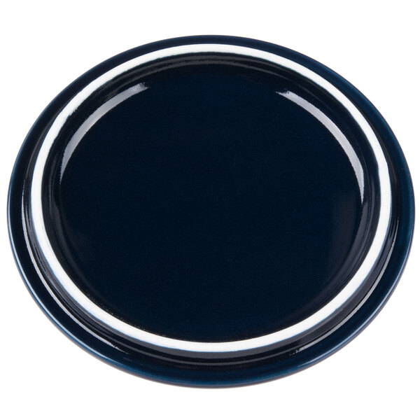 A cobalt blue porcelain lid with a white rim.