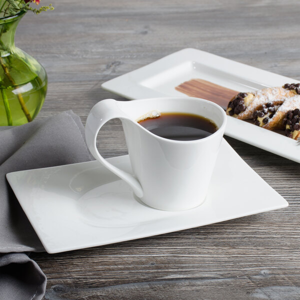A Bon Chef white bone china saucer with a cup of coffee on it.