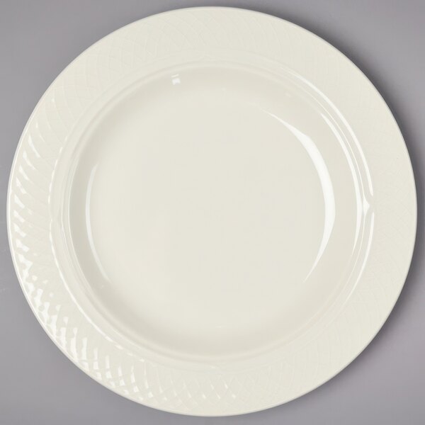 A white Homer Laughlin china bowl with a circular design on the border.