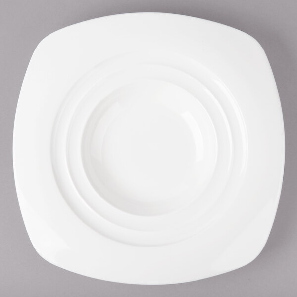 A white Bon Chef porcelain pasta bowl with a circular design on the rim.