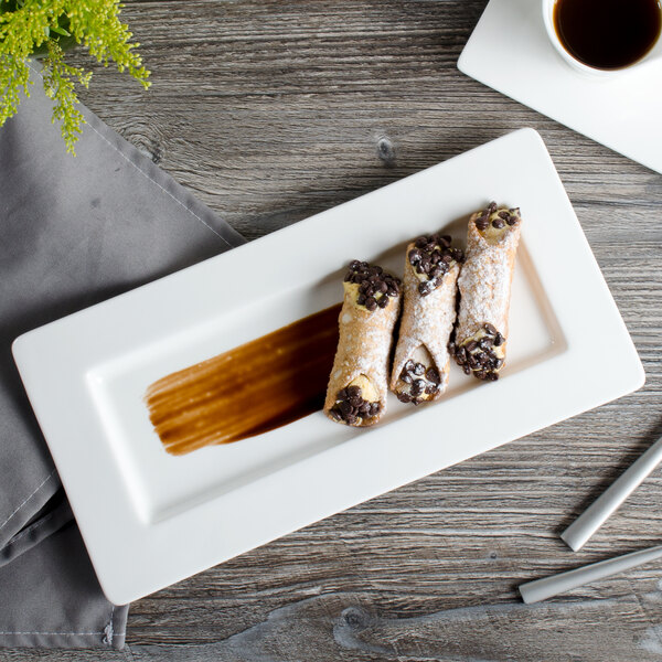 A white rectangular Bon Chef bone china plate with food on it.
