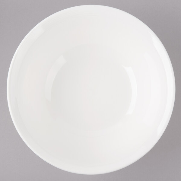 A white Bon Chef porcelain bowl with circles on a white background.