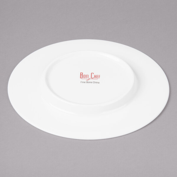 A white Bon Chef bone china bread and butter plate with red writing that says "Bon Chef"