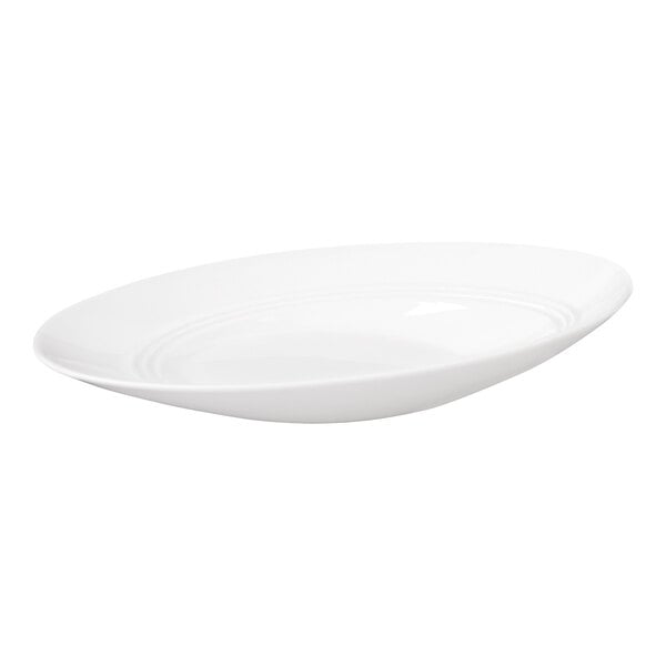A white, oval-shaped bowl with a slanted rim and a smooth, glossy finish.