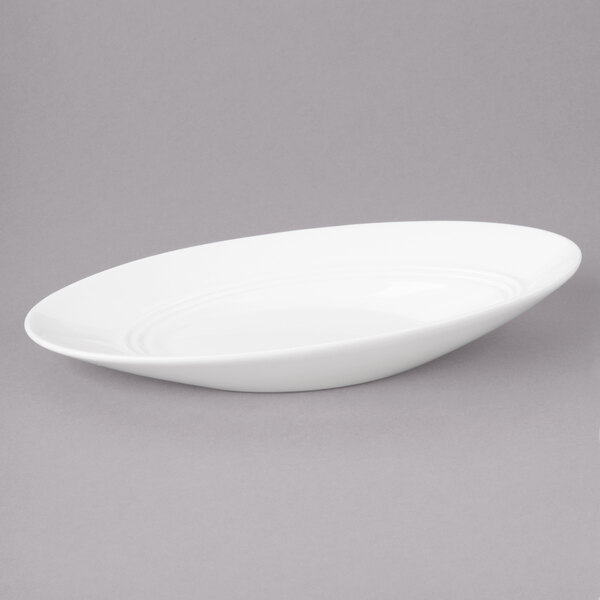 A white oval bowl with a slanted edge.