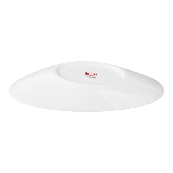 A white, oval-shaped porcelain bowl with a slanted design and a small logo in the center.
