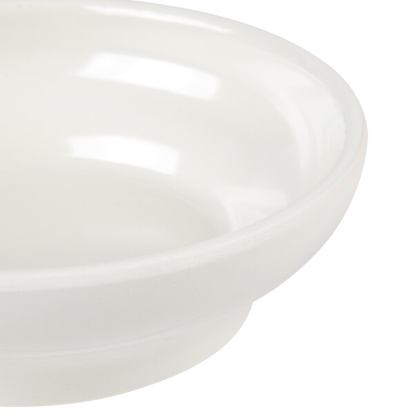A white Thunder Group Melamine salsa bowl.