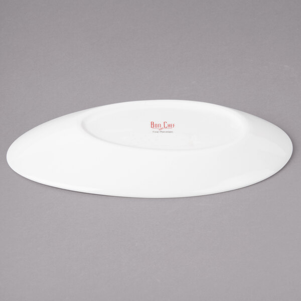 A white Bon Chef slanted oval porcelain plate.