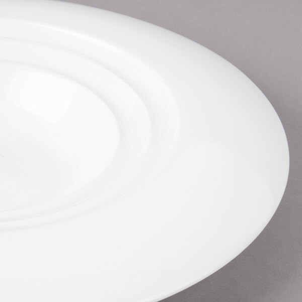 A Bon Chef white porcelain bowl with a rim.