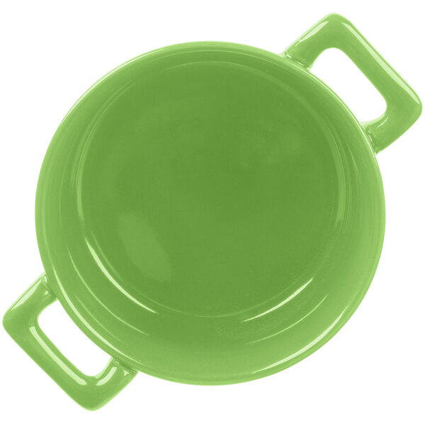 A lime green porcelain cocotte with handles.