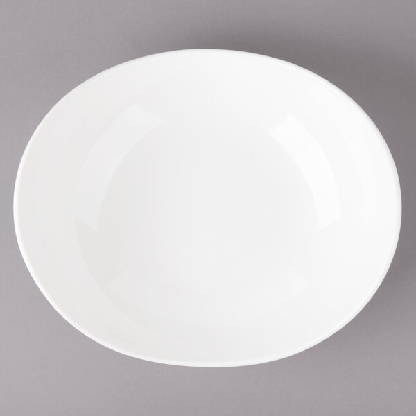 A white Bon Chef pasta bowl on a gray background.