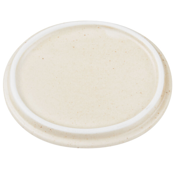 A white porcelain oval lid with a white rim.