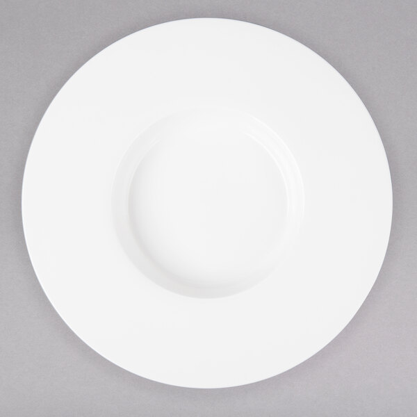 A white Bon Chef bone china pasta bowl with a wide rim.