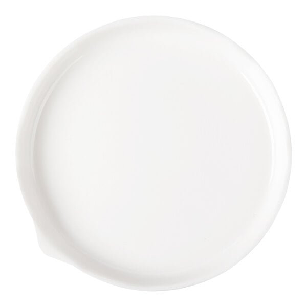 A round, white porcelain plate with a slightly raised rim and a small spout-like feature on one side.