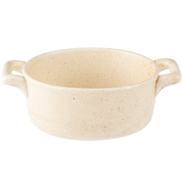 A white Bon Chef porcelain cocotte with two handles.