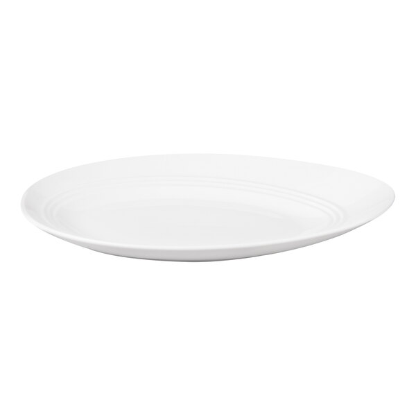A white oval plate with a slightly slanted design and subtle concentric ridges near the rim.