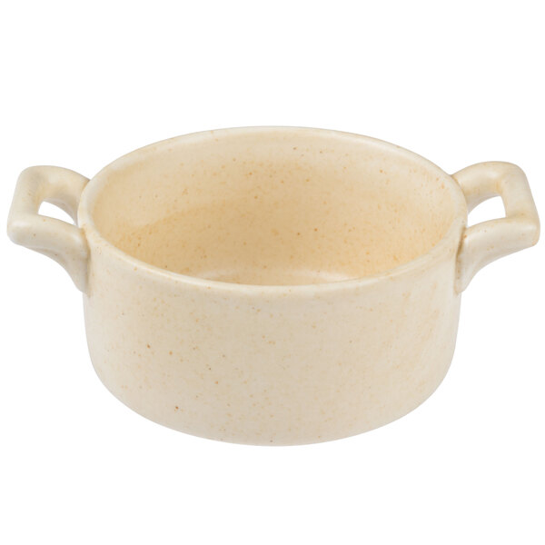A white porcelain Bon Chef cocotte with handles.