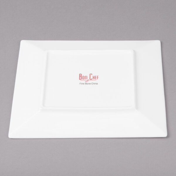 A white square plate with red text on it.