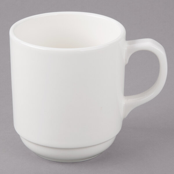 A white Bon Chef porcelain cup with a handle.