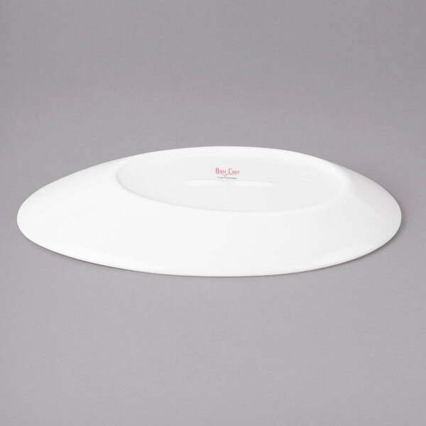 A white Bon Chef slanted oval porcelain plate.
