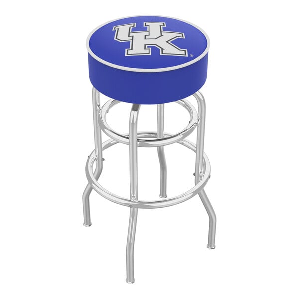 A blue bar stool with a circular UK logo and lettering on the seat pad.