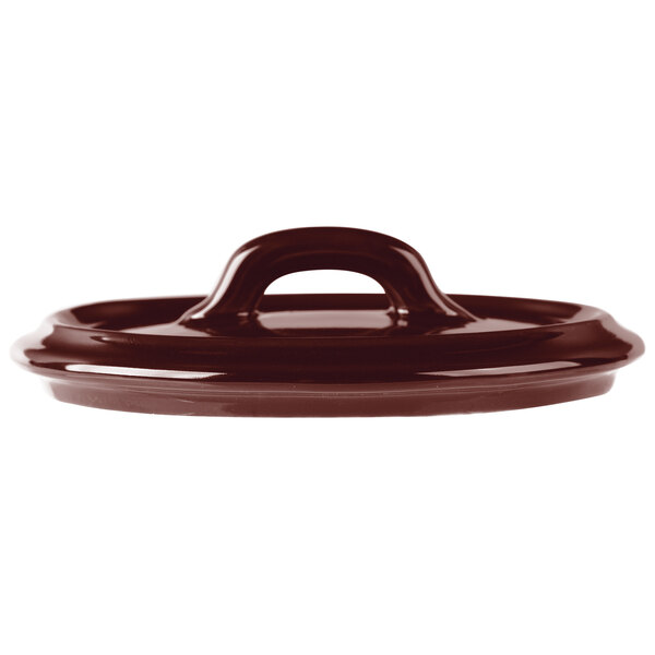 A brown Bon Chef porcelain oval cocotte lid with a handle.