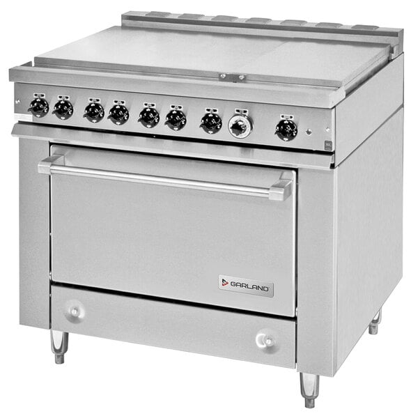 A large stainless steel Garland heavy-duty electric range with 6 boiler top sections and storage base.