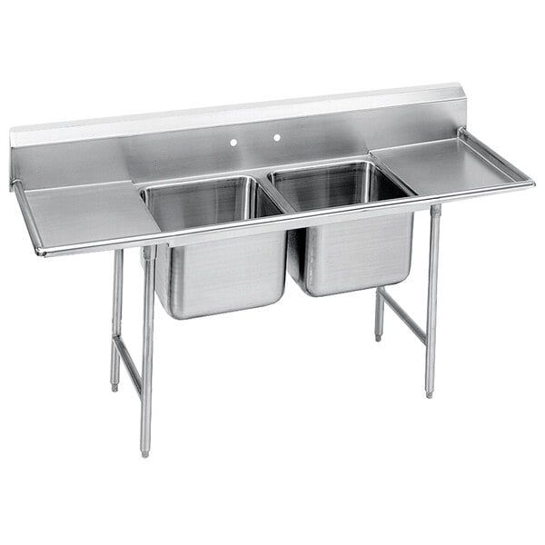 An Advance Tabco stainless steel two compartment sink with two drainboards.